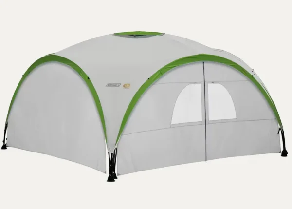 Coleman event shelter with side panels and door for enclosed outdoor setup and weather protection